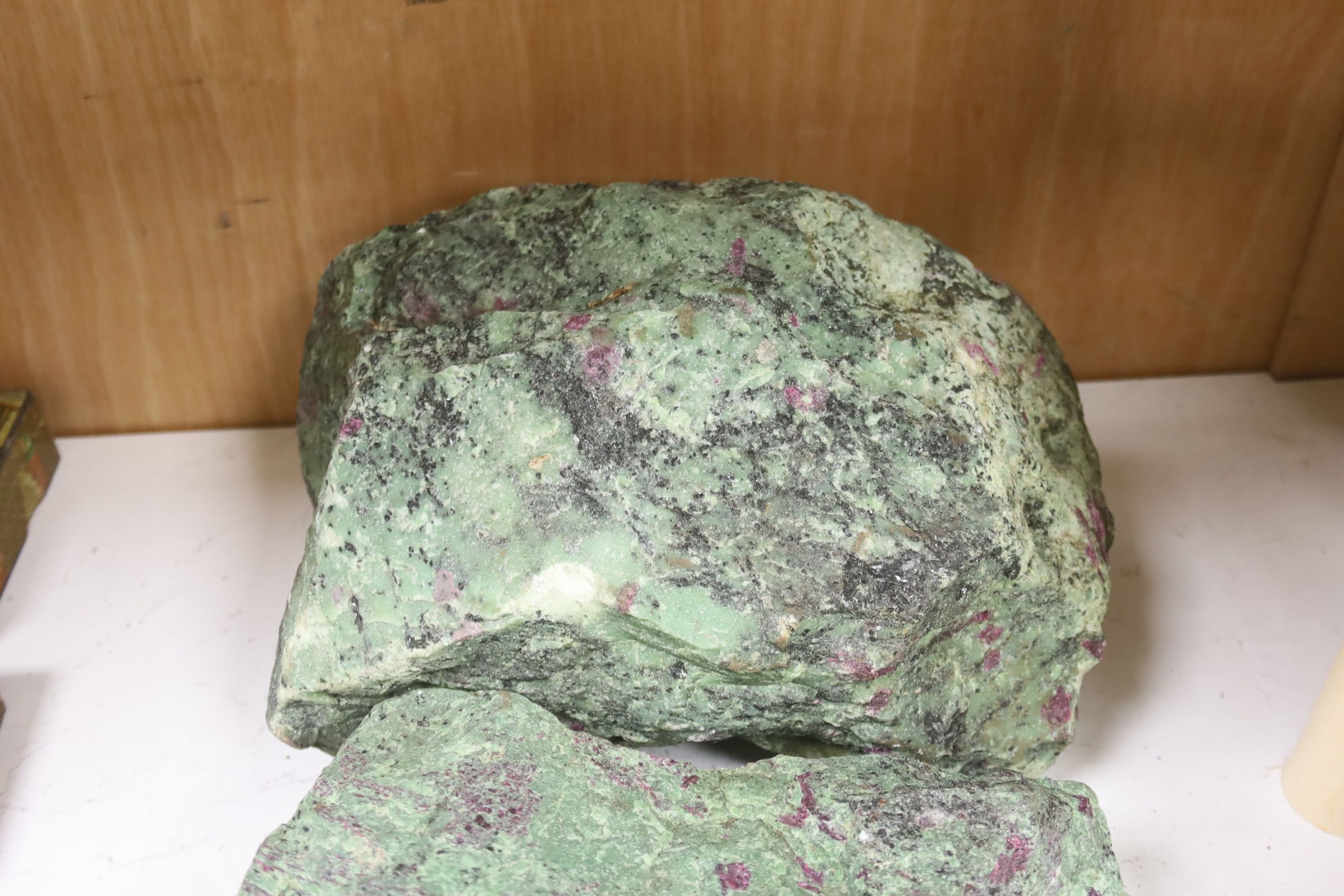 Three fragments of Anyolite (or ruby in zoisite) originating from a ruby mine in Kenya, largest 32 x 22cm